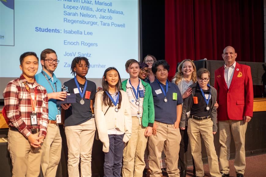 The Secondary Expo Winners, the Iron Oxide Investigators Team from Seventy-First Classical Middle School, proudly take a pic 